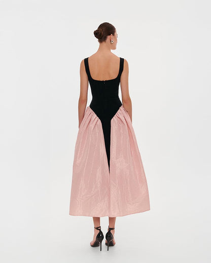 BLACK CORSET DRESS ON STRAPS WITH A GLOSSY PINK MIDI SKIRT