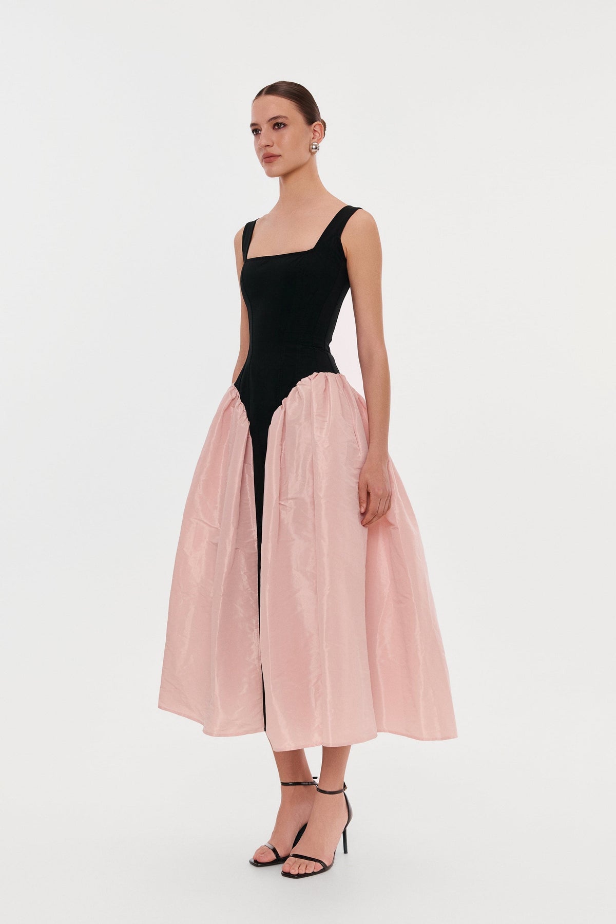 BLACK CORSET DRESS ON STRAPS WITH A GLOSSY PINK MIDI SKIRT
