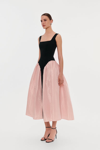 BLACK CORSET DRESS ON STRAPS WITH A GLOSSY PINK MIDI SKIRT