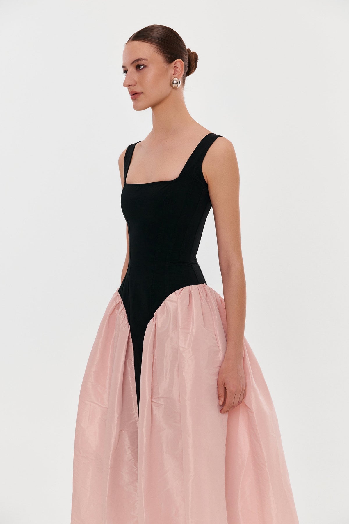 BLACK CORSET DRESS ON STRAPS WITH A GLOSSY PINK MIDI SKIRT
